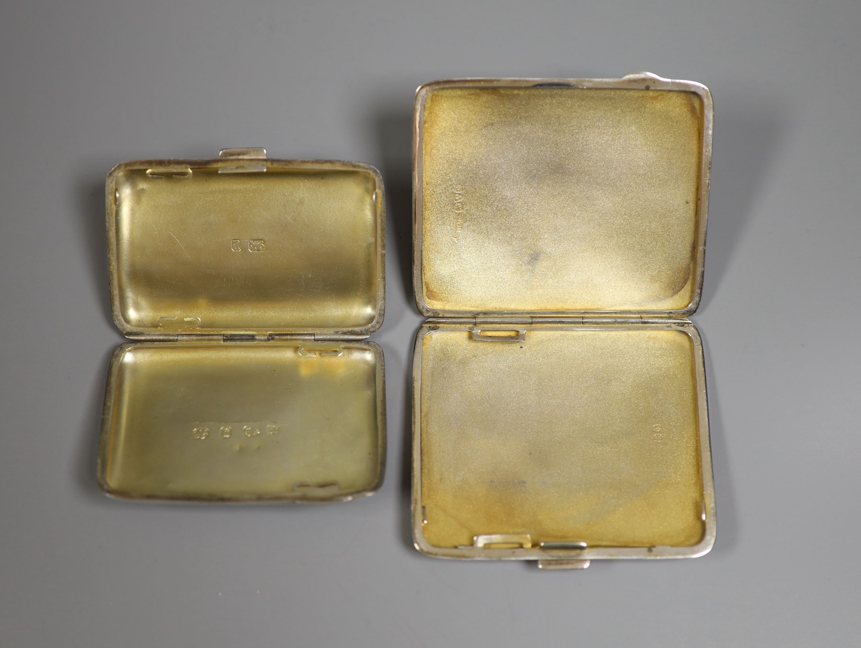 Two engine turned silver cigarette cases, including late Victorian, largest 86mm.